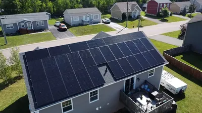 Home with rooftop solar panels in a Maritime neighbourhood